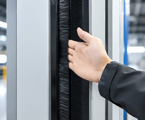 Brush sealing structure for clear PVC high speed fabric door
