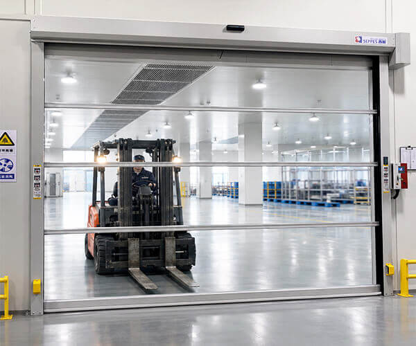 Transparent PVC rapid door installed at a forklift crossing